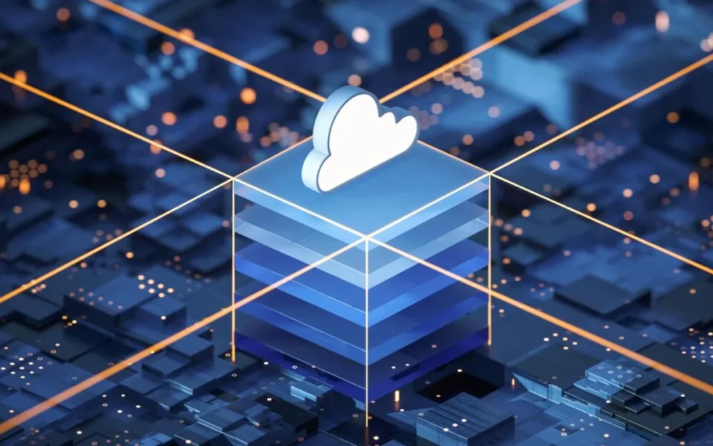 A futuristic depiction of a glowing cloud icon atop a three-dimensional transparent cube, surrounded by a network of interconnected blue blocks representing a digital environment, illuminated with orange and yellow light beams.