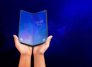A pair of hands holding an open, foldable smartphone with a glowing blue geometric pattern on the screen, set against a dark blue background.
