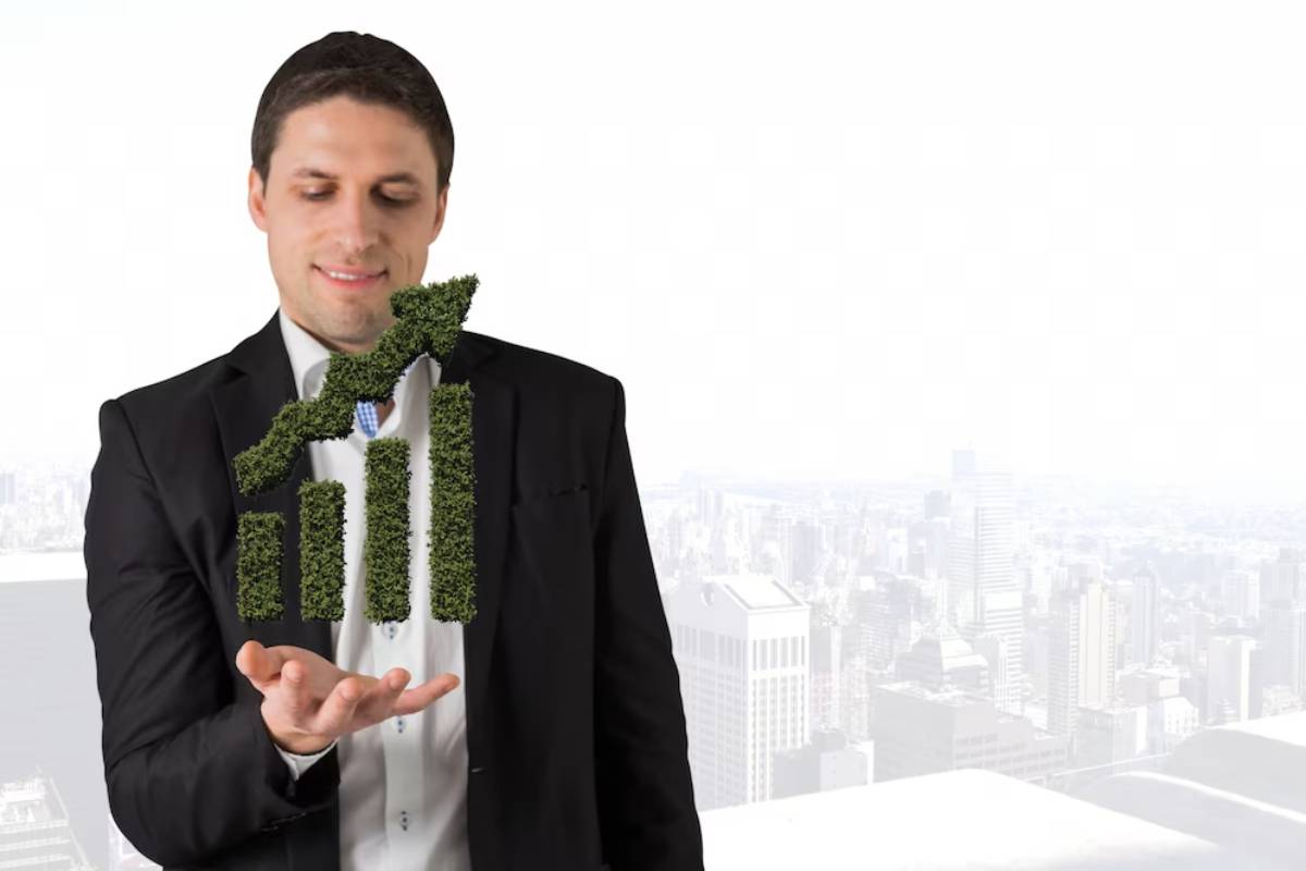 A businessman in a suit displays a green plant graph, symbolizing growth and sustainability, with a city skyline in the background.