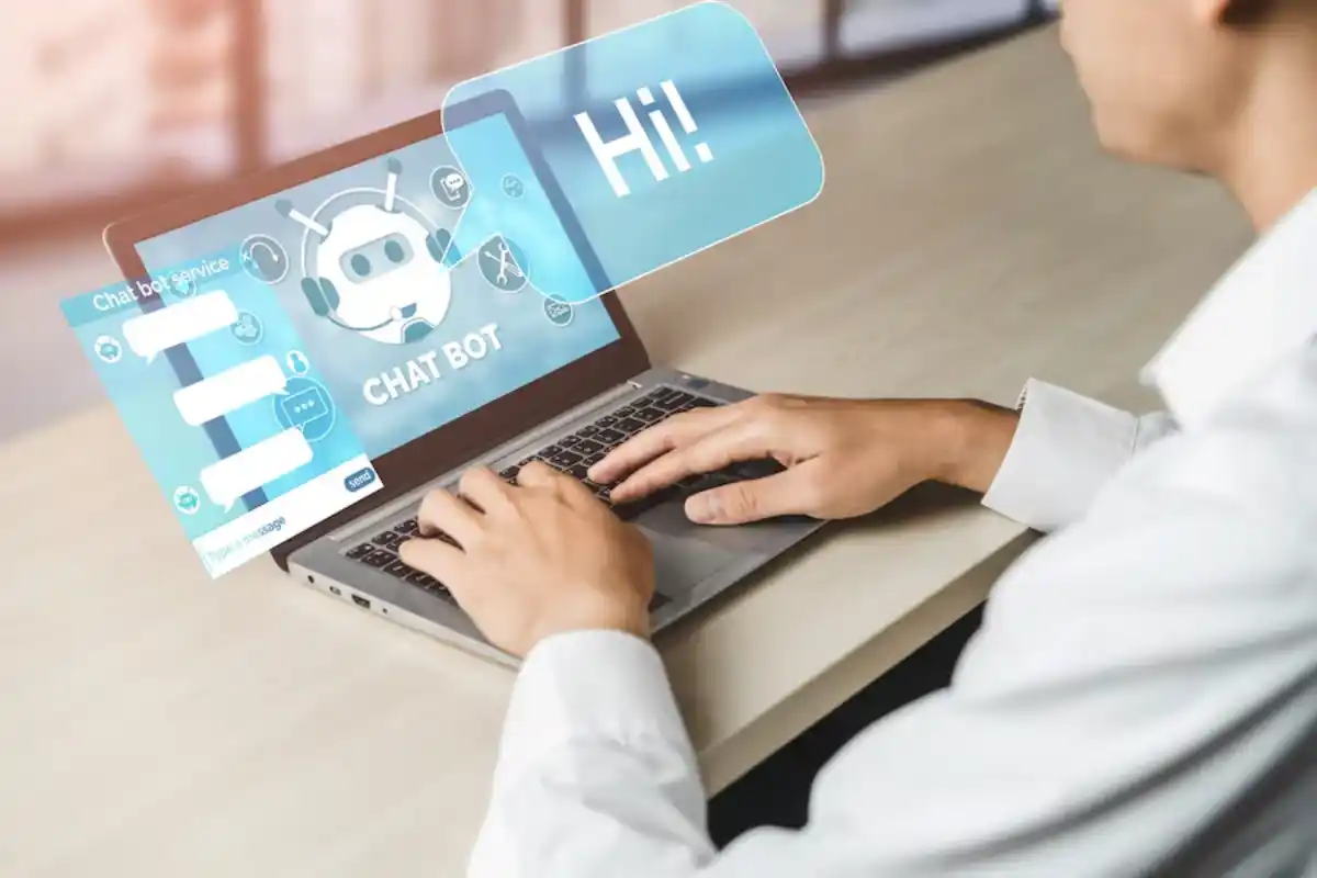 Person using laptop with chatbot